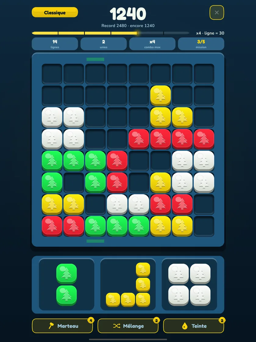 Puzzle de blocs sur iPad : une partie de Stakko en thème Noël, plateau pleine largeur